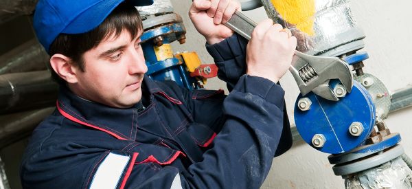 Water Engineer maintaining system on service contact